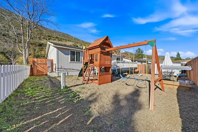 a view of a house with backyard porch and sitting area