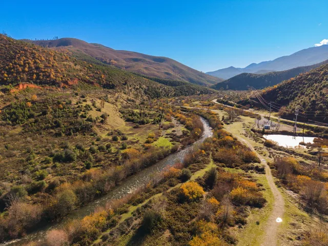 a view of a city with mountains in the background