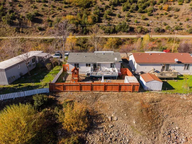an aerial view of a house with a lake view