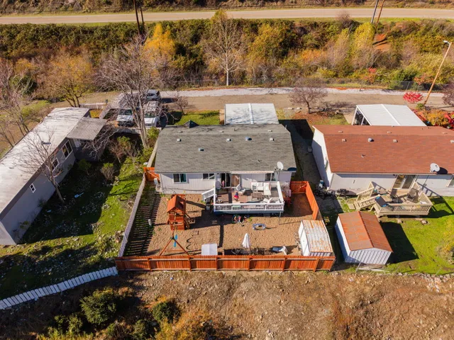 an aerial view of residential houses with outdoor space