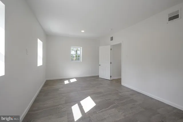 a view of an empty room and window