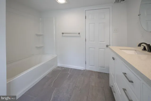 a bathroom with a sink and a bathtub