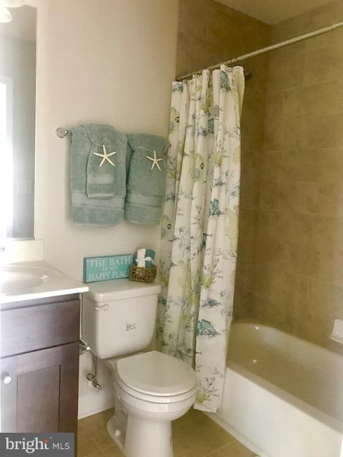 439 West Maple Road Linthicum Heights, MD 21090 - Photo 21 of 30 a white toilet sitting next to a bath tub