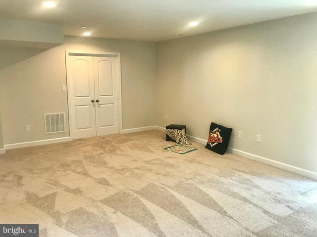 439 West Maple Road Linthicum Heights, MD 21090 - Photo 22 of 30 a view of a livingroom with wooden floor and cabinet