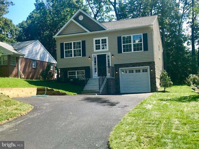 439 West Maple Road Linthicum Heights, MD 21090 - Photo 28 of 30 a front view of a house with a yard and garage