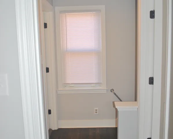 a bathroom with a bathtub and a window