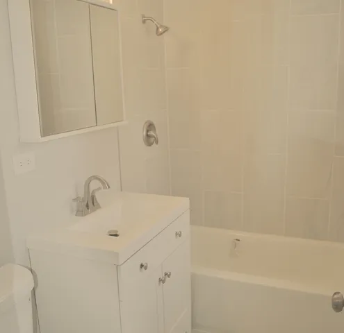 a bathroom with a sink and a bathtub