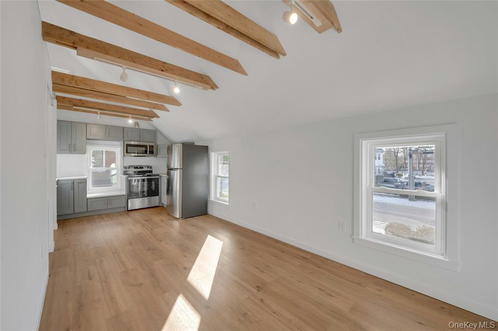 150 Bedford Road Armonk, NY 10504 - Photo 4 of 12 a view of a kitchen with furniture and a kitchen