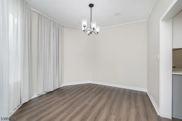a view of a chandelier fan in a room