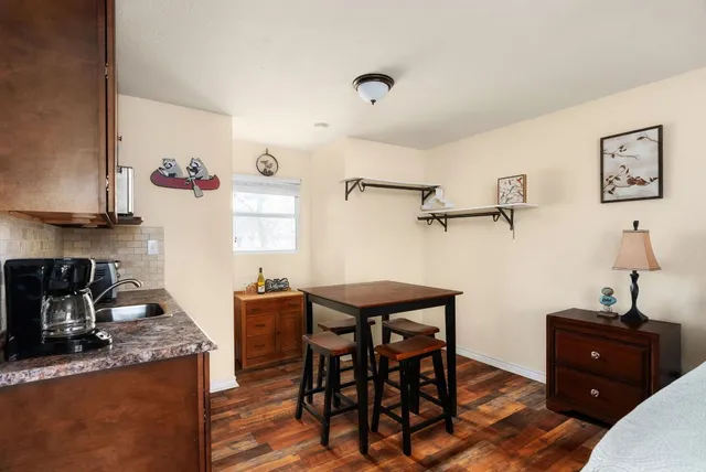 a bedroom with a bed and a ceiling fan