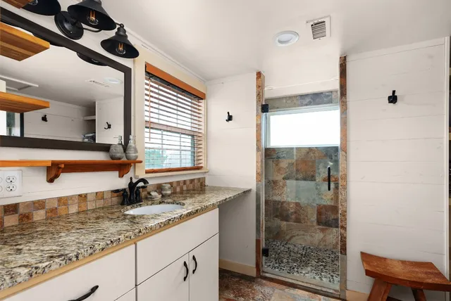 a bedroom with a bed and a table in it