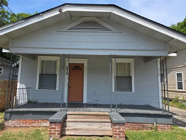 a front view of a house with garage