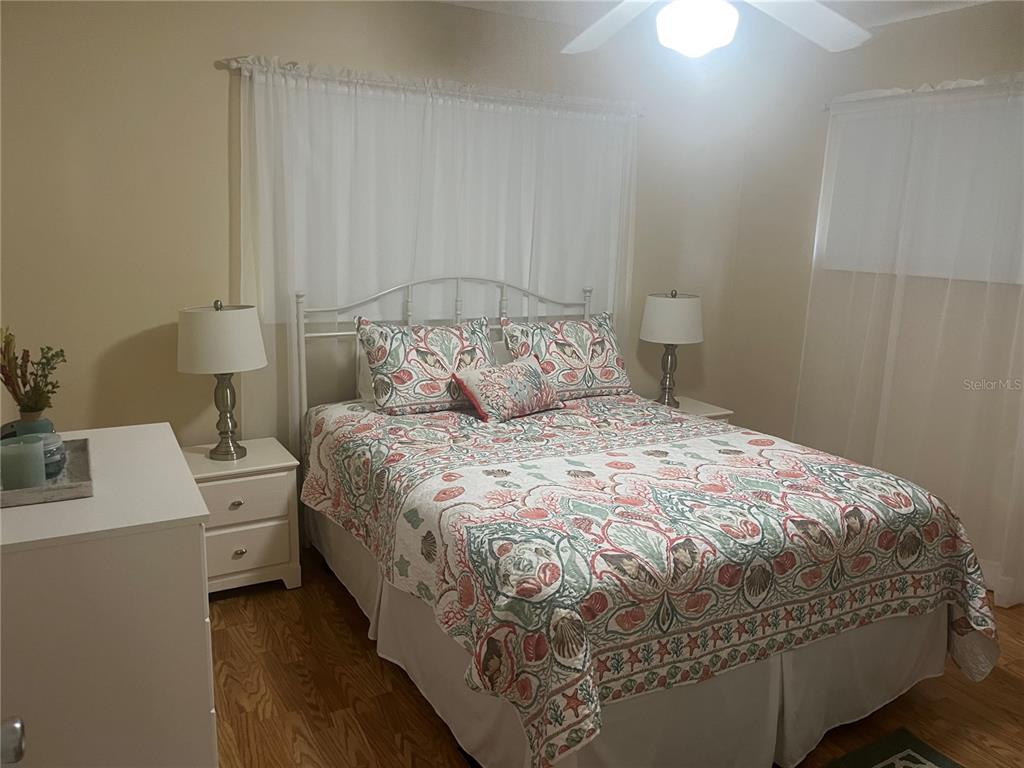 9881 Southwest 87th Terrace Road, Unit A Ocala, FL 34481 - Photo 2 of 7 a bedroom with a bed and a table