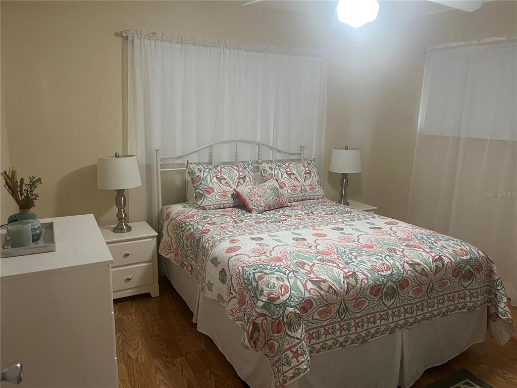 9881 Southwest 87th Terrace Road, Unit A Ocala, FL 34481 - Photo 3 of 7 a bedroom with a bed and a table