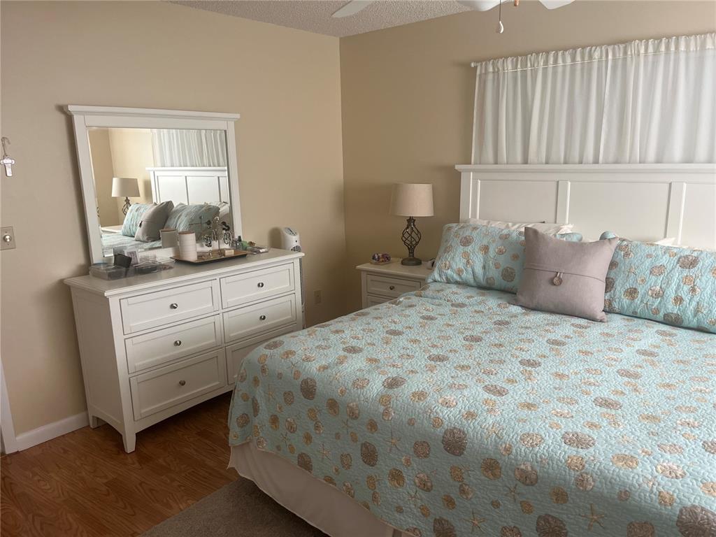 9881 Southwest 87th Terrace Road, Unit A Ocala, FL 34481 - Photo 4 of 7 a bedroom with a bad and dresser