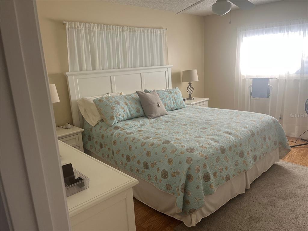 9881 Southwest 87th Terrace Road, Unit A Ocala, FL 34481 - Photo 5 of 7 a bed sitting in a bedroom next to a window