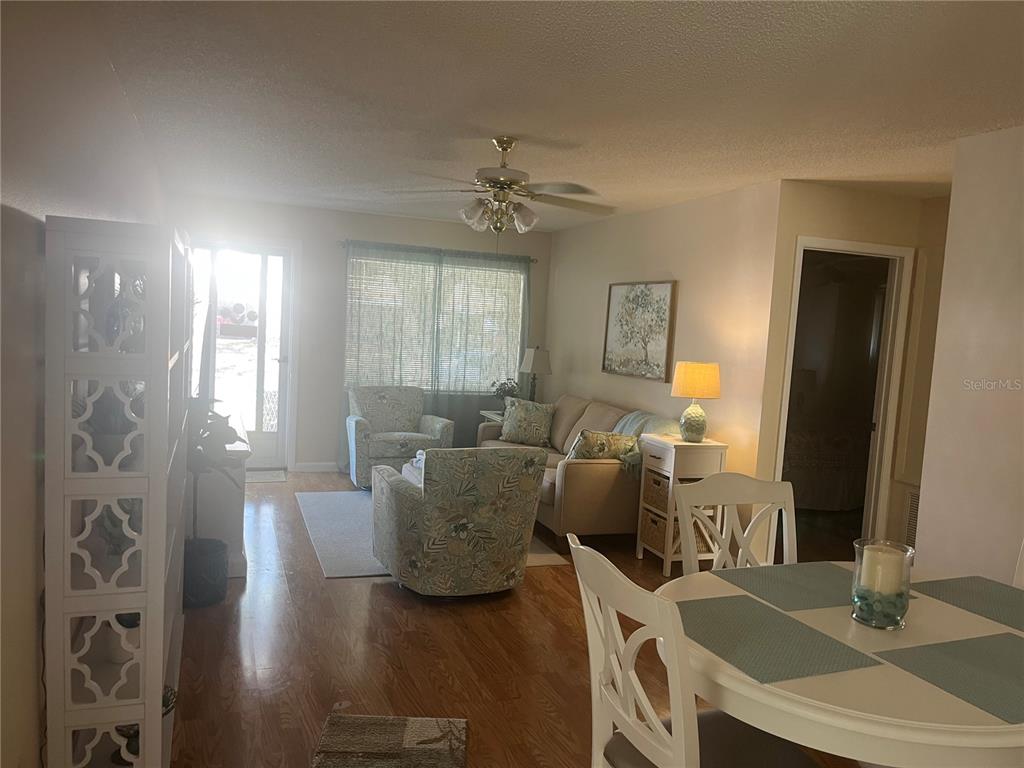 9881 Southwest 87th Terrace Road, Unit A Ocala, FL 34481 - Photo 7 of 7 a dining room with furniture and wooden floor