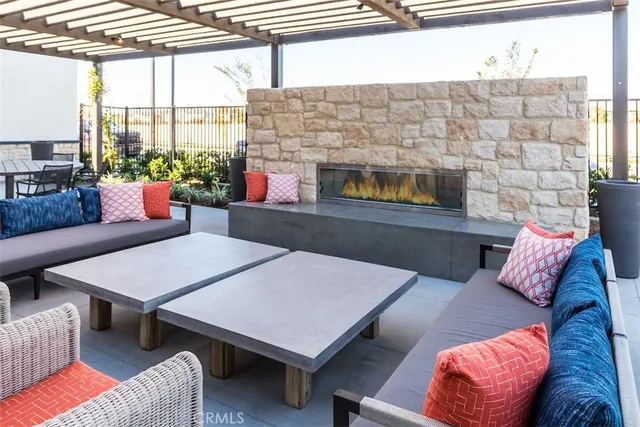 a outdoor space with patio couches and a potted plant