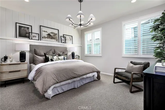 a bedroom with bed and window