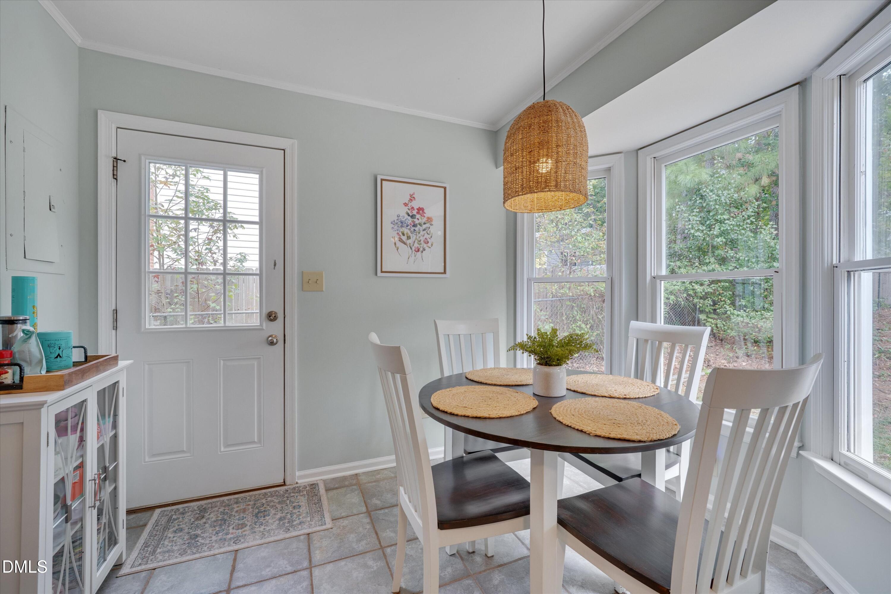 3301 Lassiter Street Durham, NC 27707 - Photo 14 of 32 a view of a dining room with furniture window and outside view