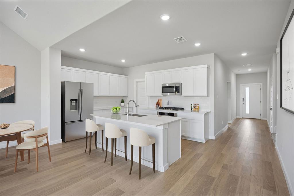 1432 Companero Street Haslet, TX 76052 - Photo 8 of 36 Kitchen in the Masters home plan by Trophy Signature Homes – REPRESENTATIVE PHOTO