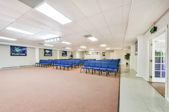 a room with furniture and pool table