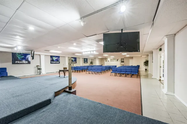 a view of a living room and kitchen