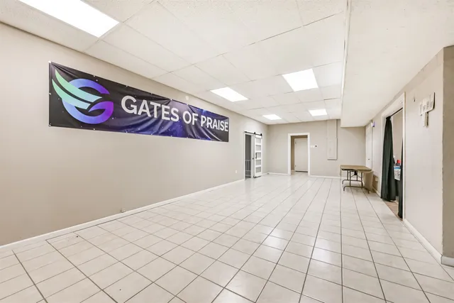 a view of a room with a refrigerator