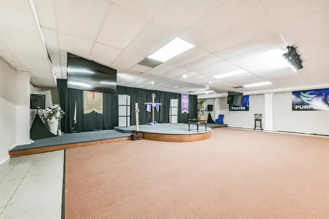 a view of a livingroom with furniture and a fireplace