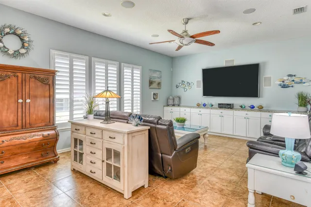 a view of a dining room with furniture large windows and wooden floor