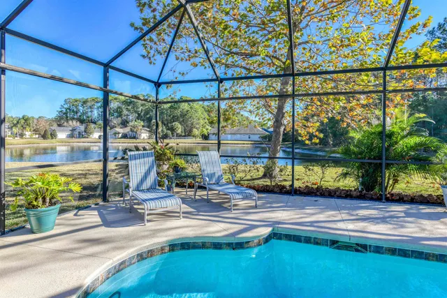 a bathroom with a granite countertop sink a mirror and a shower