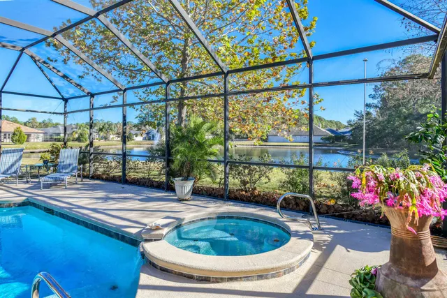 a close view of walk in closet with clothes and shoes
