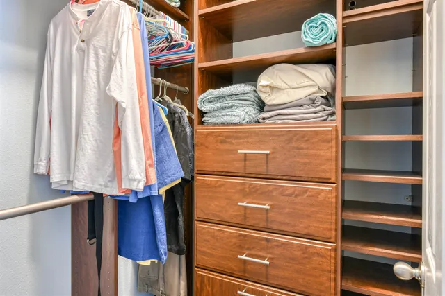 a living room with furniture pool table and a floor to ceiling window