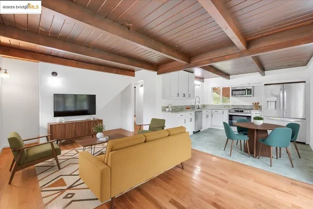 a kitchen with stainless steel appliances granite countertop a stove and a refrigerator