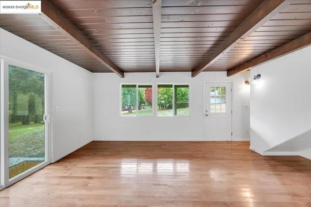 a kitchen with granite countertop stainless steel appliances and white cabinets