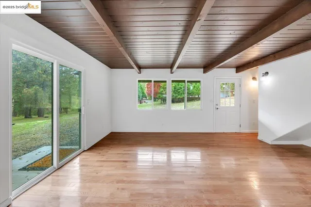 a view of hallway with wooden floor
