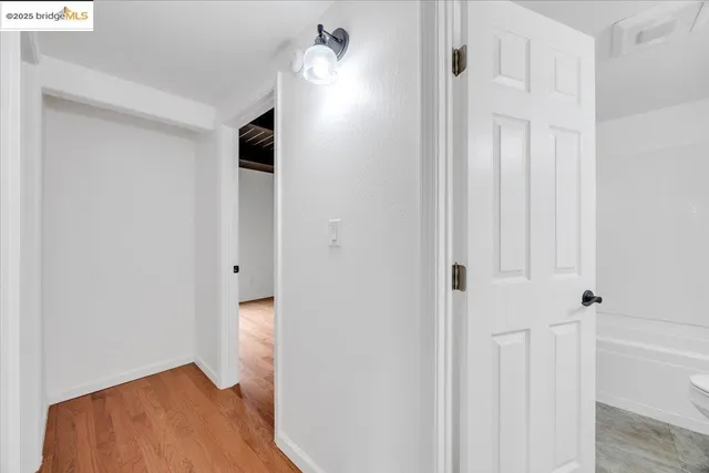 a view of room with wooden floor