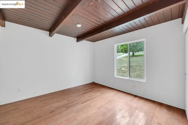 a view of hallway with wooden floor