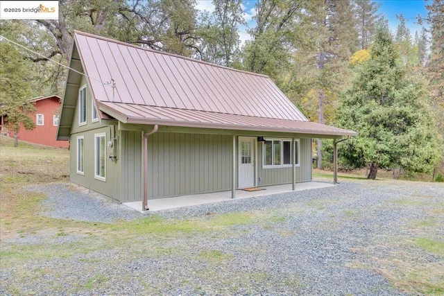 a house with trees in the background