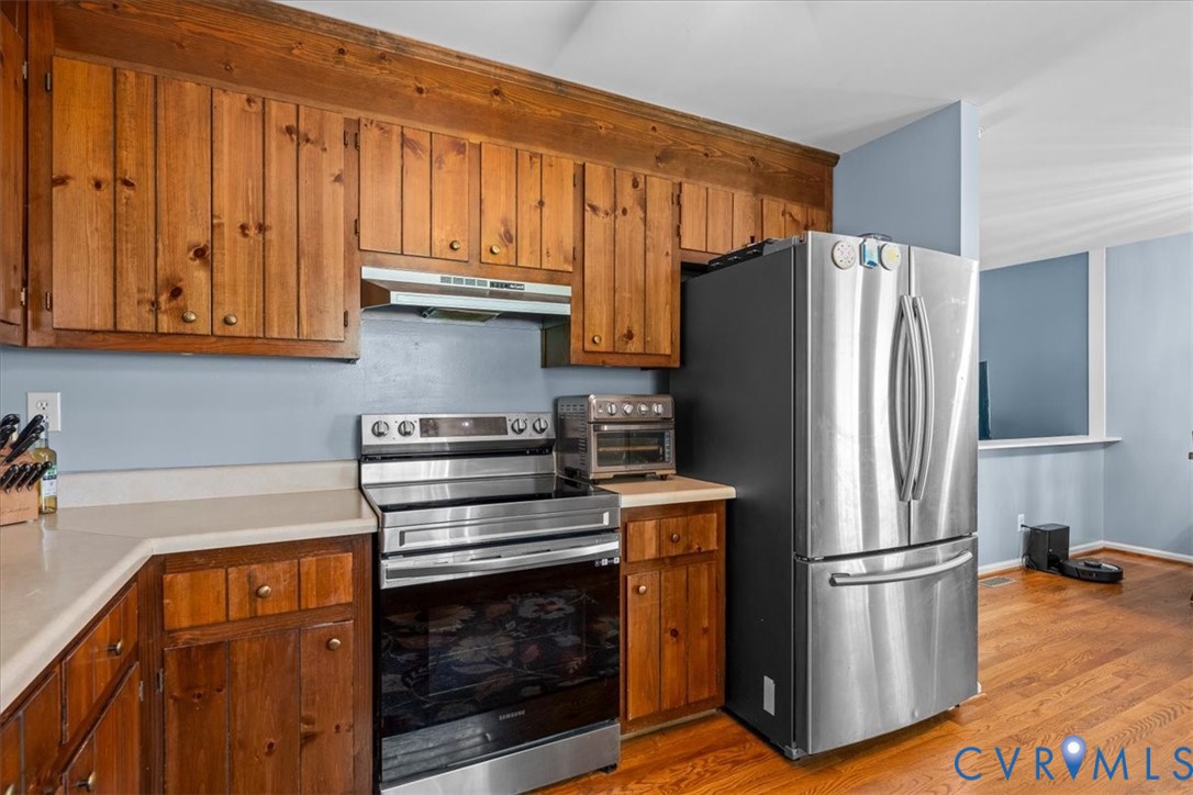 16203 Rowlett Road Chesterfield, VA 23838 - Photo 16 of 35 Kitchen featuring wood cabinetry, stainless steel