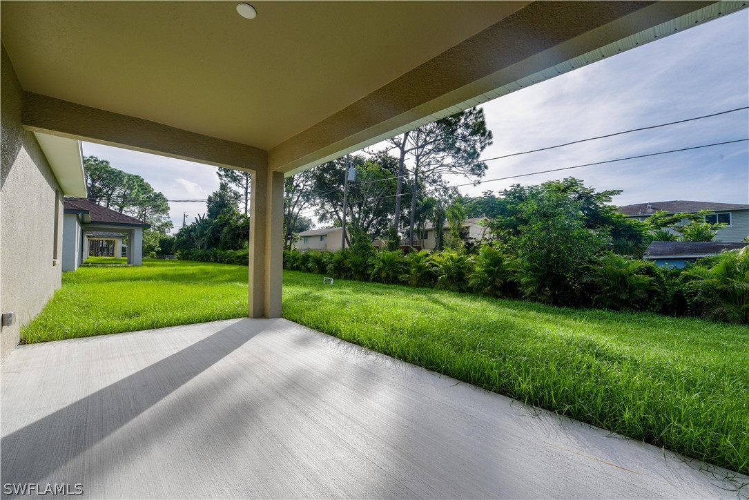 8160 Anhinga Road Fort Myers, FL 33967 - Photo 23 of 25 a view of a house with a big yard