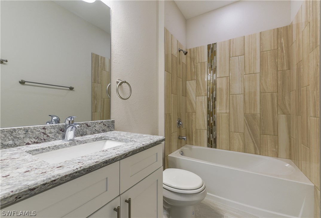 8160 Anhinga Road Fort Myers, FL 33967 - Photo 9 of 25 a bathroom with a granite countertop sink toilet and shower