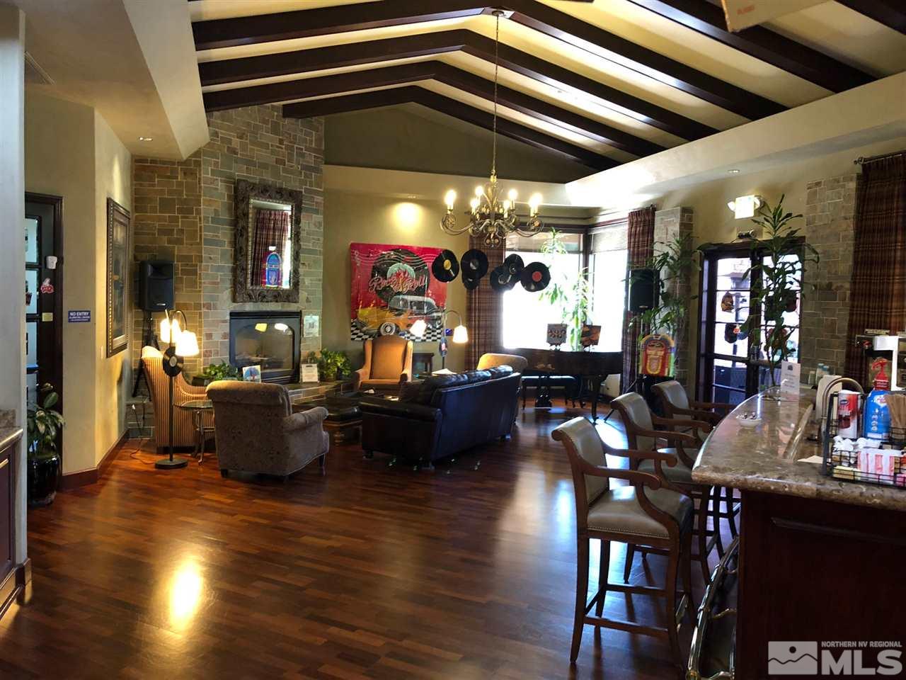 900 South Meadows Parkway, Unit 1712 Reno, NV 89521 - Photo 13 of 13 a living room with furniture and a chandelier