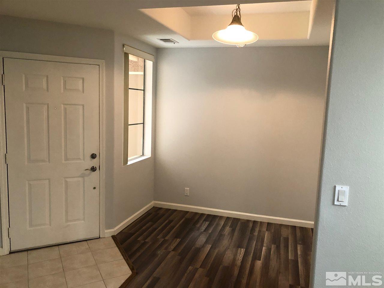900 South Meadows Parkway, Unit 1712 Reno, NV 89521 - Photo 6 of 13 a view of empty room with wooden floor and fan