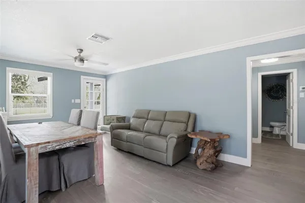 a bench sitting in a room next to a window