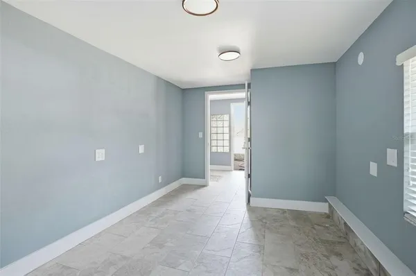 a view of an empty room with a window