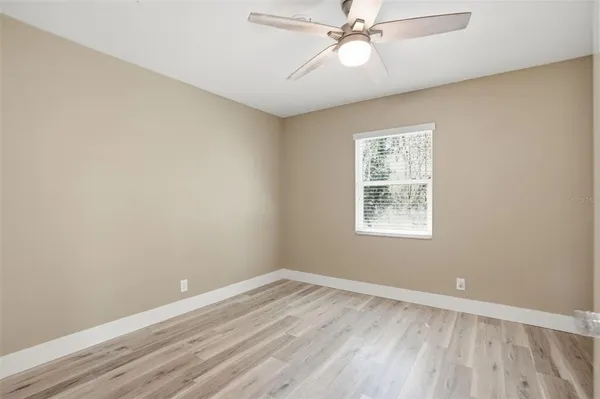 a bathroom with a toilet sink and a mirror