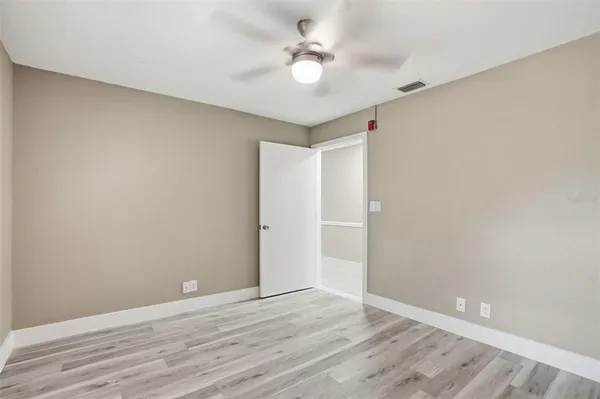 a house view with swimming pool in front of it