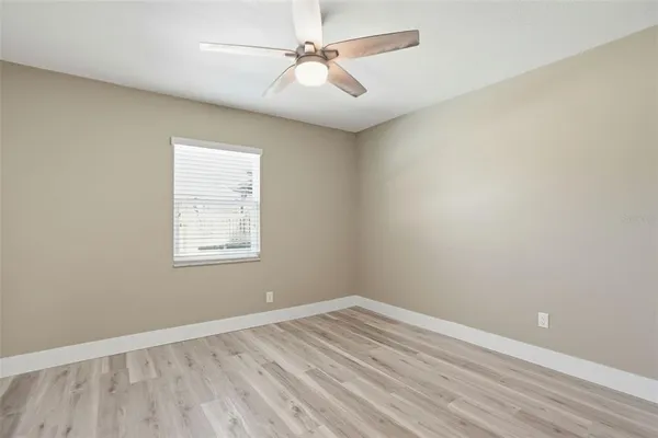 a house with swimming pool in front of it