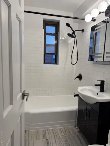 a bathroom with a sink and a bathtub
